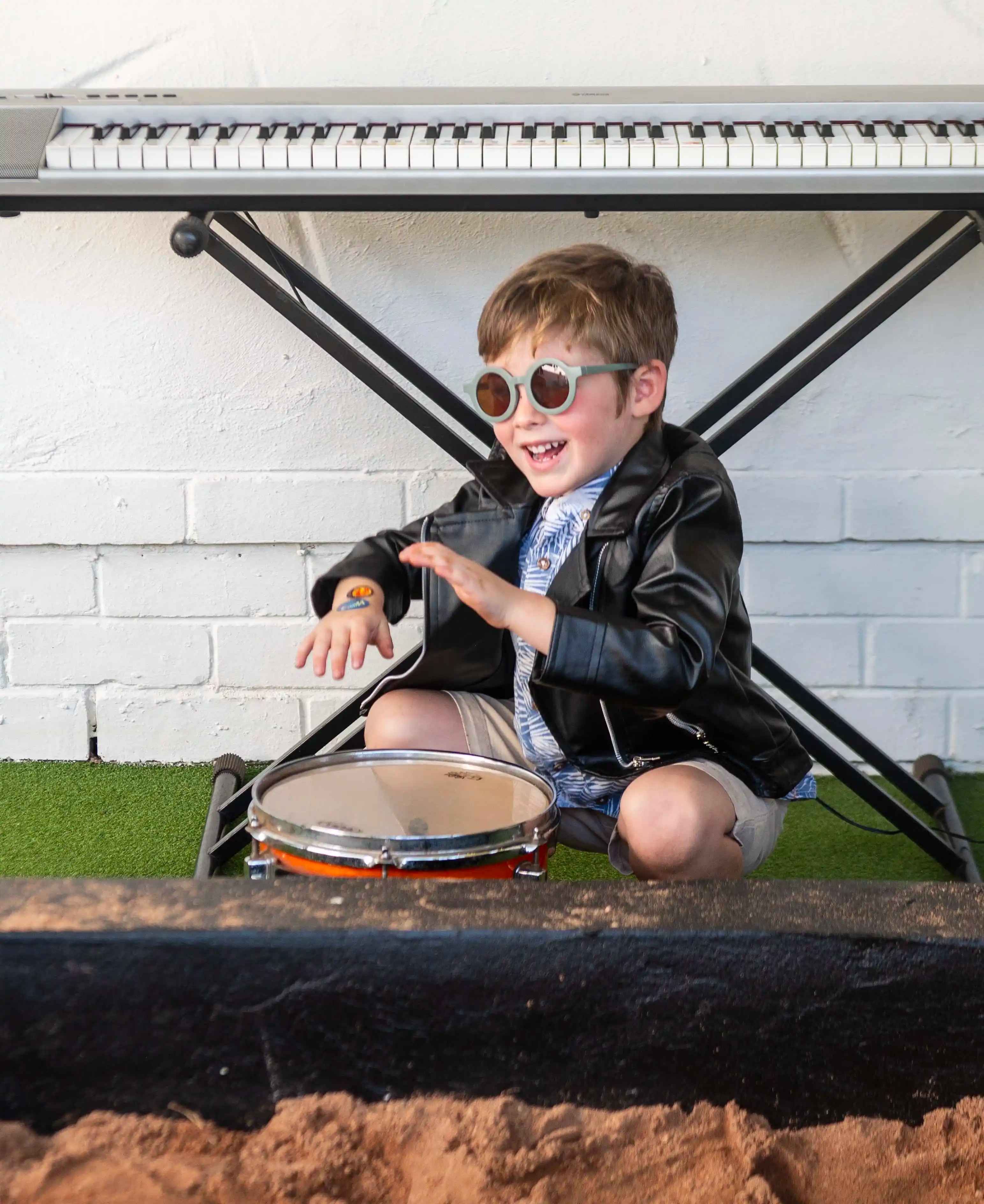 Young musician with drum and keyboard